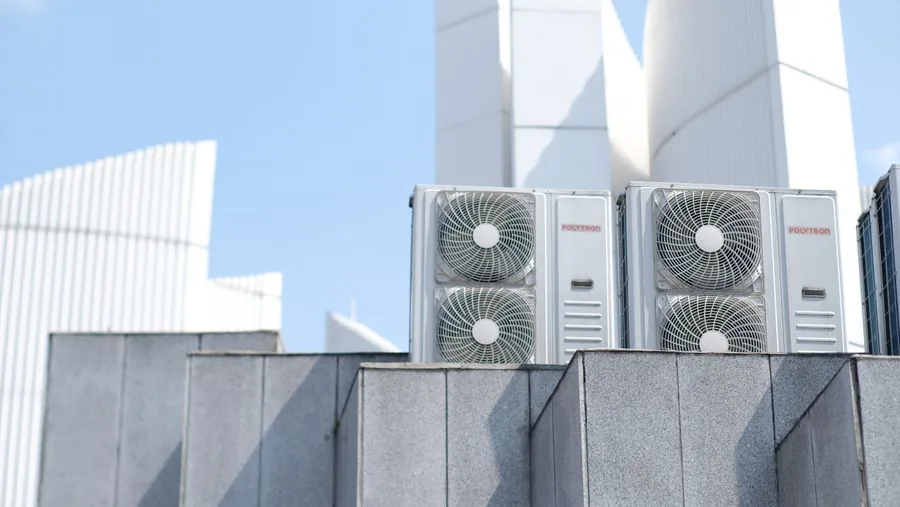 Commercial rooftop HVAC condenser units on a building roof